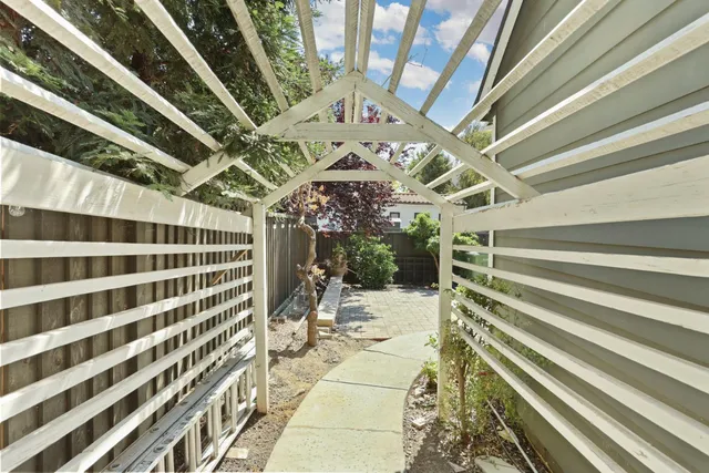 a view of a house with a yard and sitting area