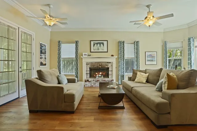 a living room with furniture and a fireplace