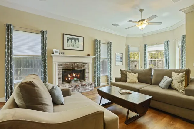 a living room with furniture and a fireplace