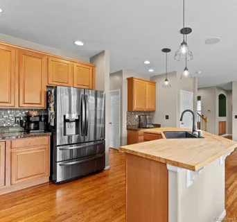 a spacious bathroom with a granite countertop sink mirror and a