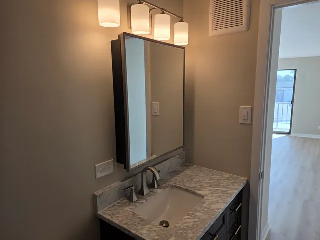 a view of a room with wooden floor and stairs