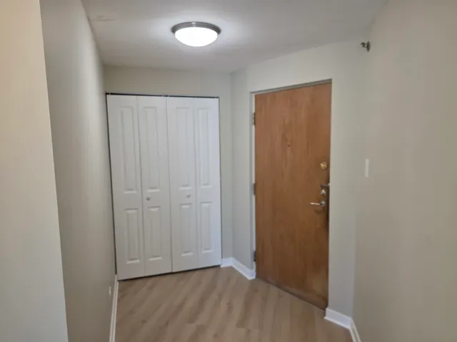a bathroom with a sink mirror and toilet