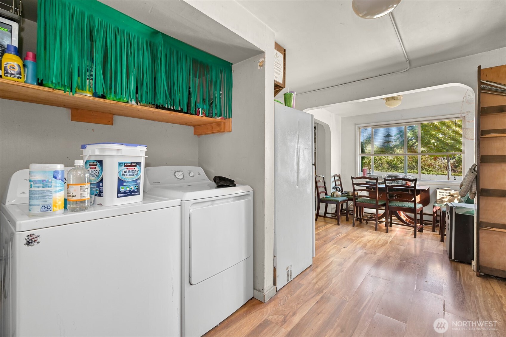 923 24th Street Bellingham, WA 98225 - Photo 11 of 38 a utility room with dryer washer and a view of living room