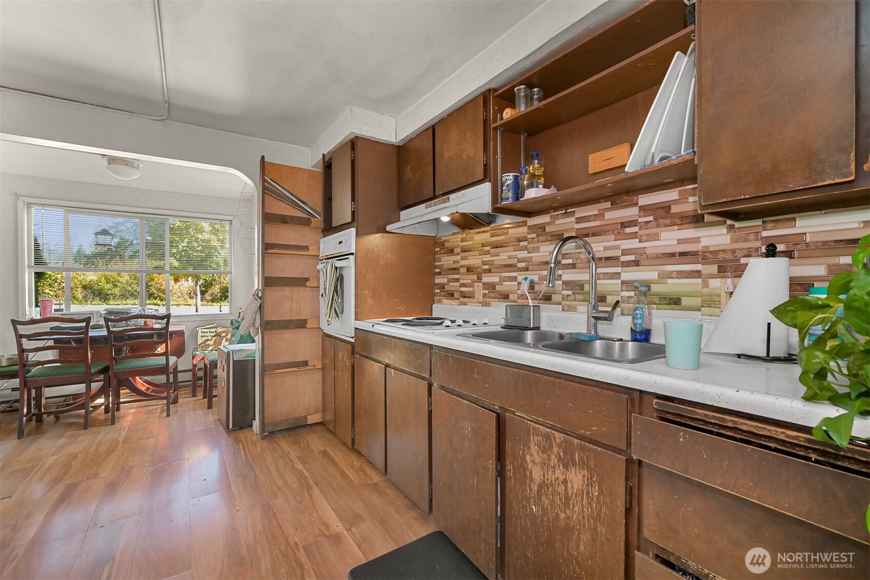923 24th Street Bellingham, WA 98225 - Photo 13 of 38 a kitchen with appliances cabinets and wooden floor