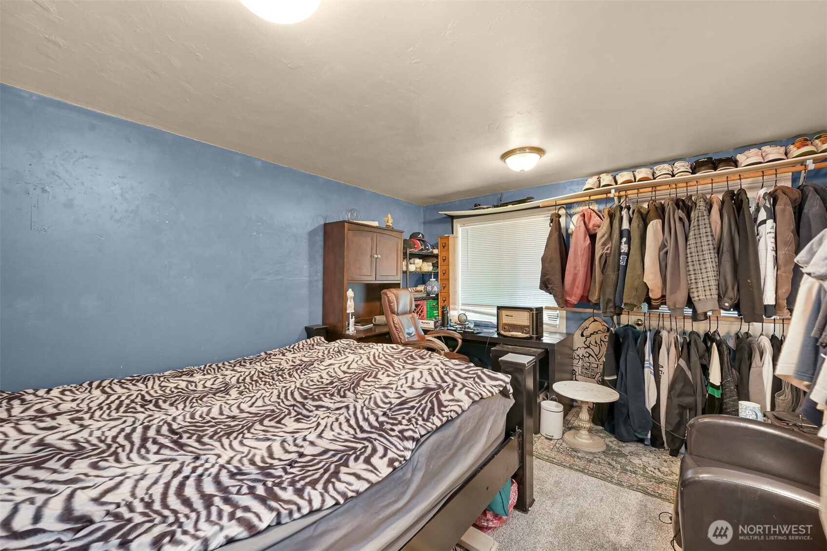 923 24th Street Bellingham, WA 98225 - Photo 19 of 38 a bedroom with a bed and wooden floor