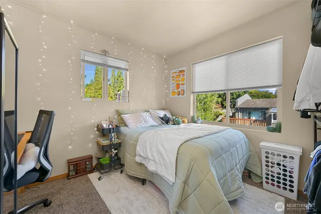 a bed room with a bed and a chair