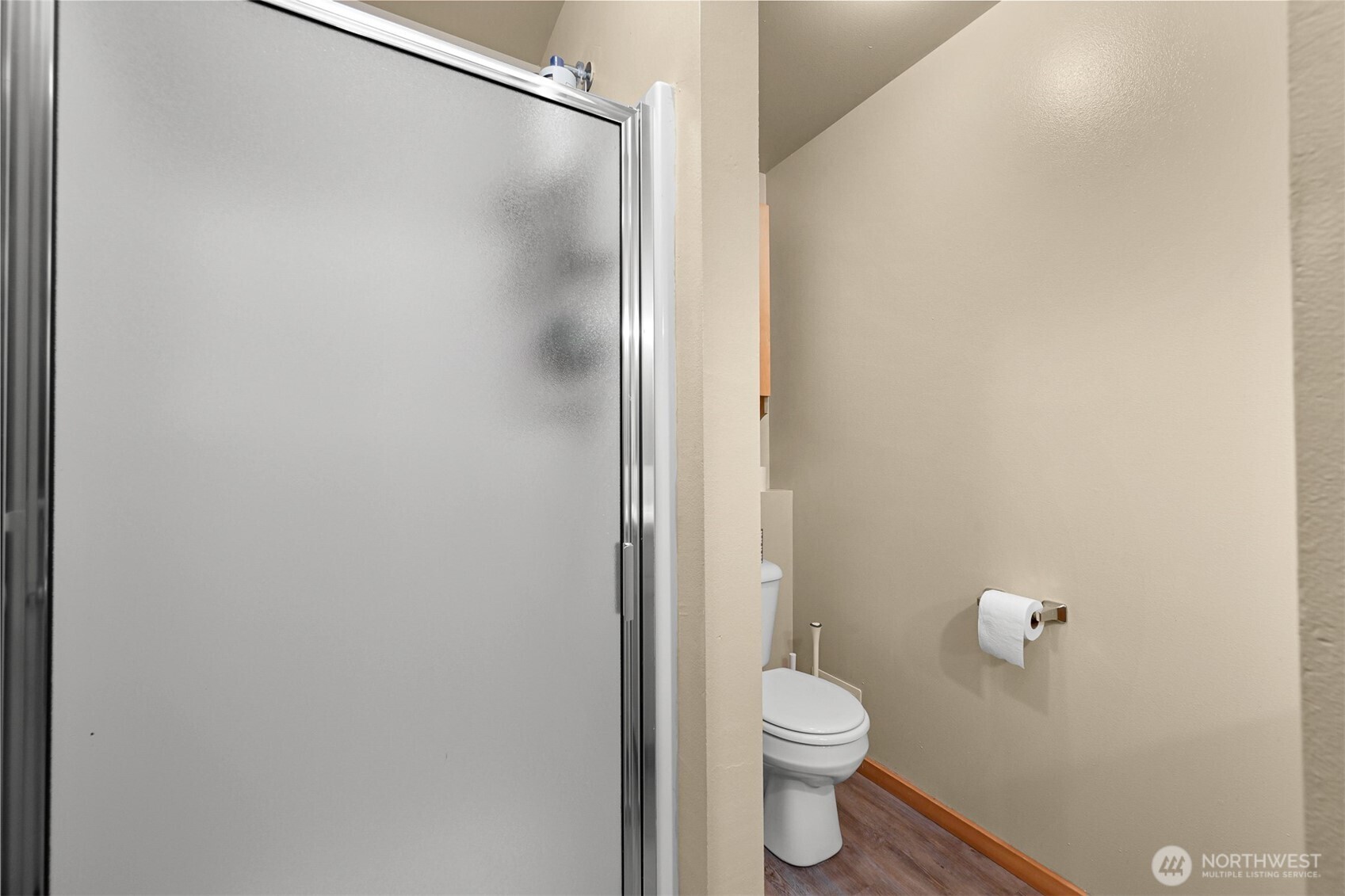 923 24th Street Bellingham, WA 98225 - Photo 31 of 38 a bathroom with a granite countertop toilet and a shower
