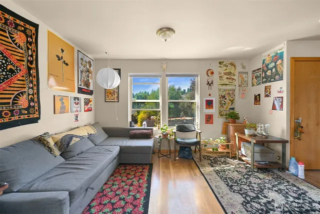 a living room with furniture and a rug