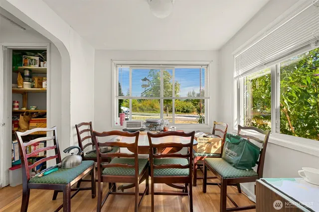 a view of a dining room with furniture window and outside view