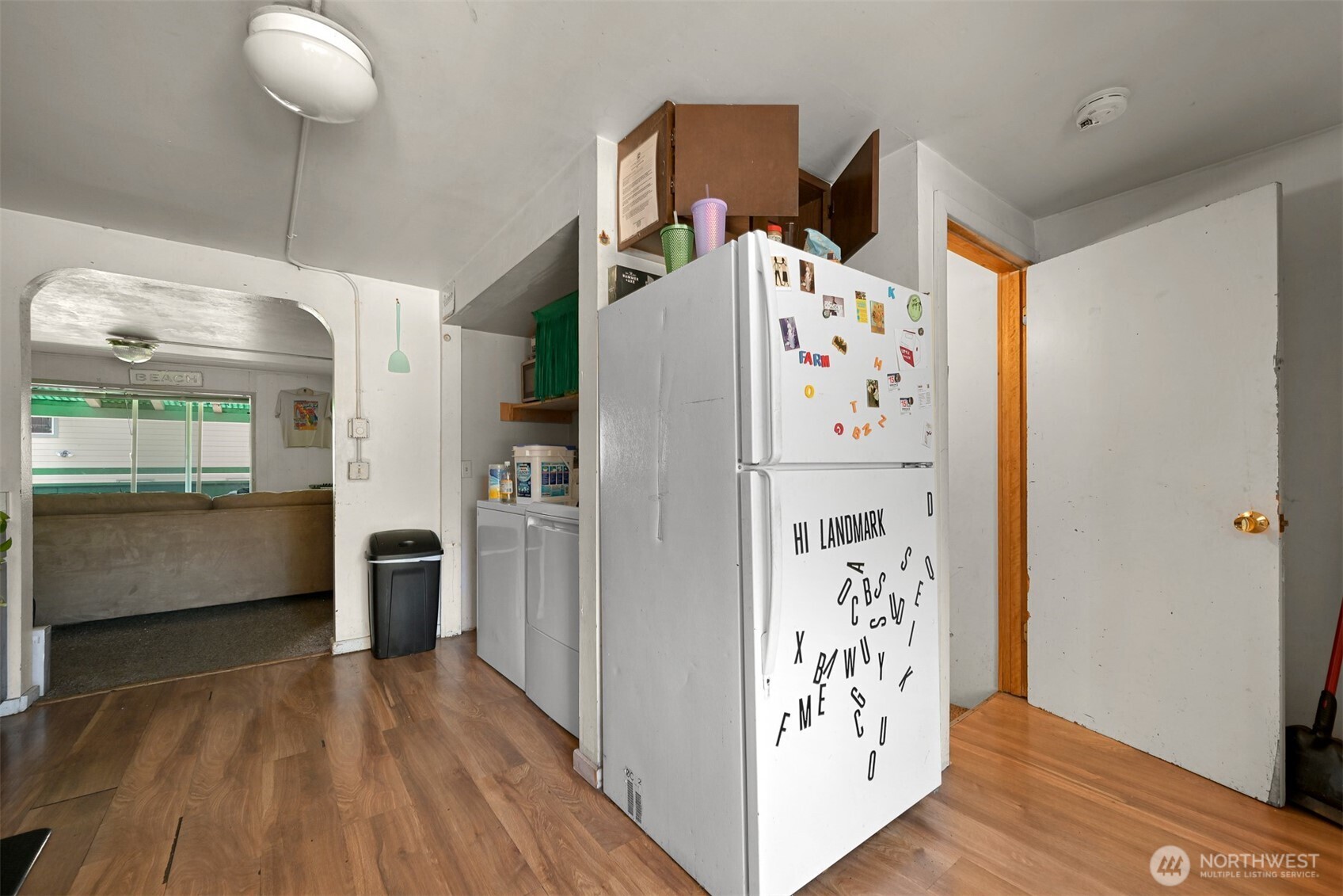 923 24th Street Bellingham, WA 98225 - Photo 10 of 38 a kitchen with stainless steel appliances a refrigerator and a wooden floor