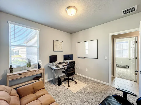 a workspace with furniture and a window