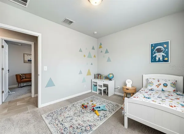 a bedroom with a bed and furniture