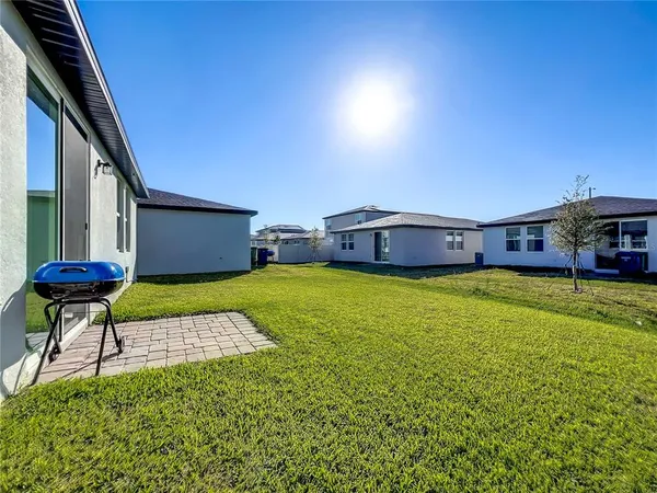a front view of a house with a yard table and chairs