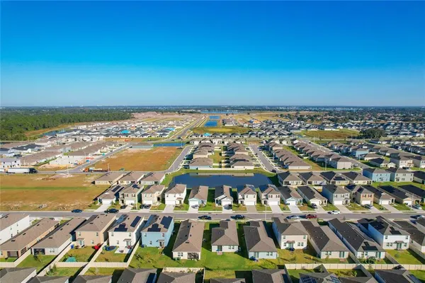 a view of a lake with a table and chairs