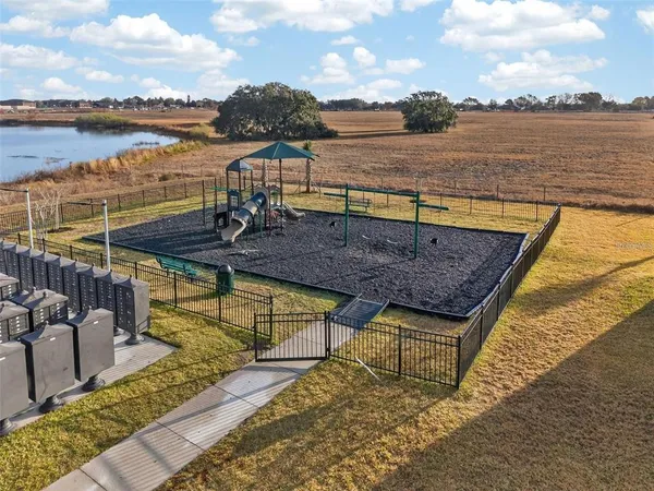 swimming pool view with a lake view