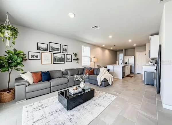 a living room with furniture white walls and white walls