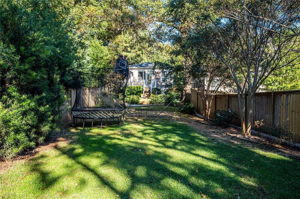 123 Ansley Street Decatur, GA 30030 - Photo 61 of 61 a view of backyard with table and chairs and a large tree