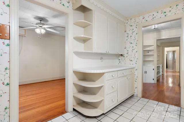 a bathroom with a sink a vanity and a mirror