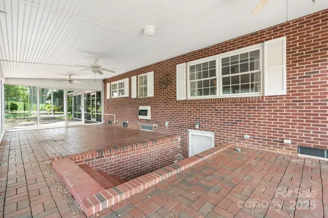 a view of a room window and wooden floor