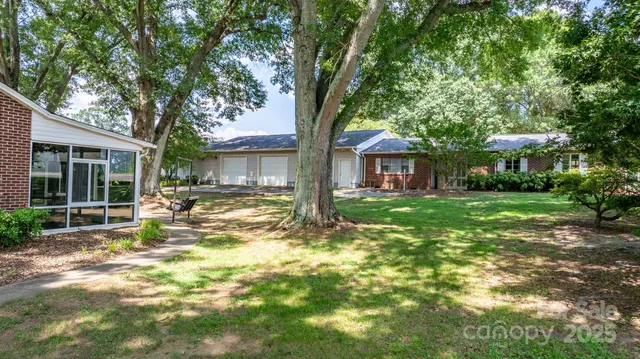 a view of a house with a yard porch and sitting area