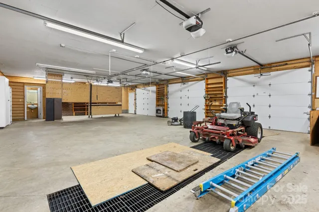 a large kitchen with granite countertop a sink and a large window