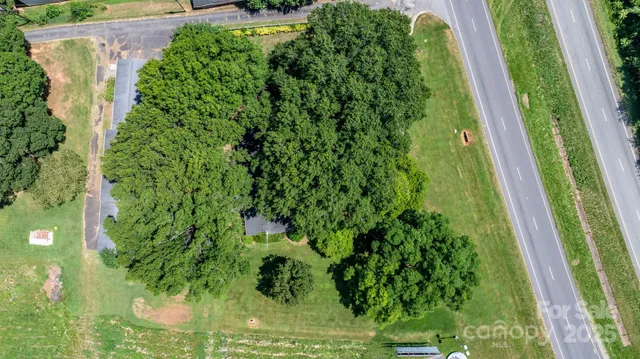 an aerial view of residential house with outdoor space and street view