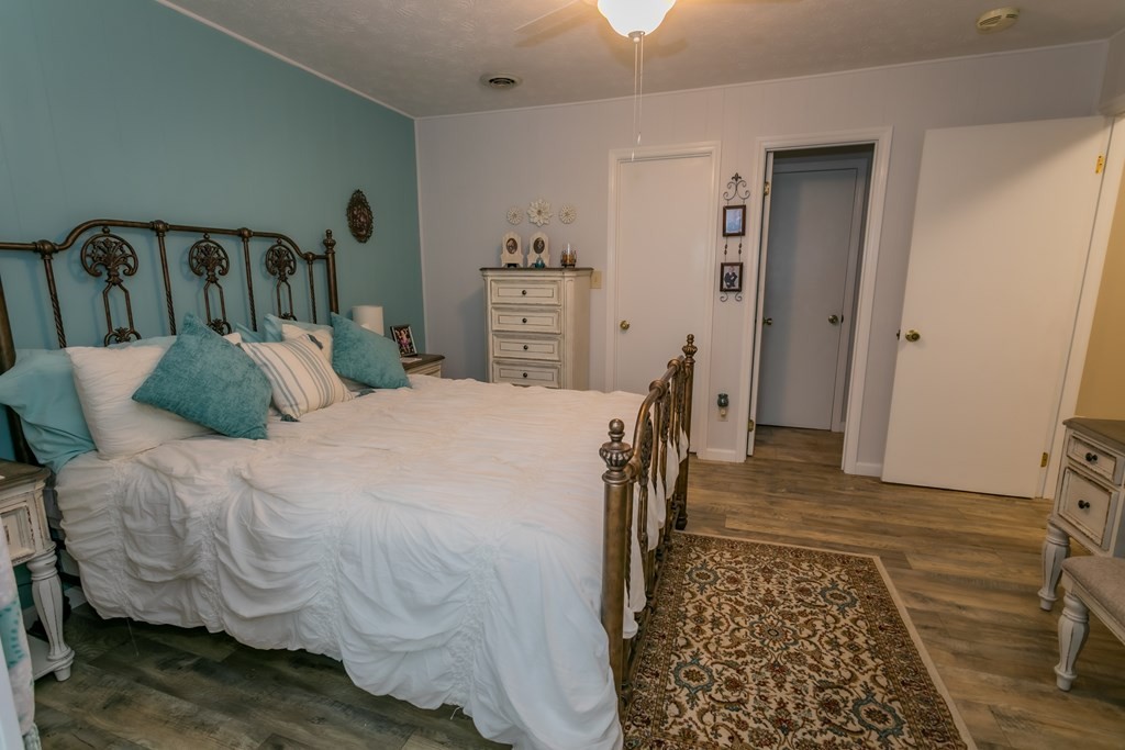 3108 Fortenberry Road Kodak, TN 37764 - Photo 14 of 47 a bedroom with a bed and wooden floor