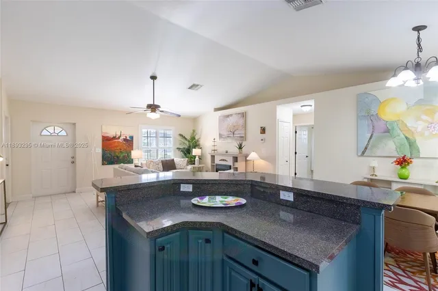 a kitchen with a table and chairs in it