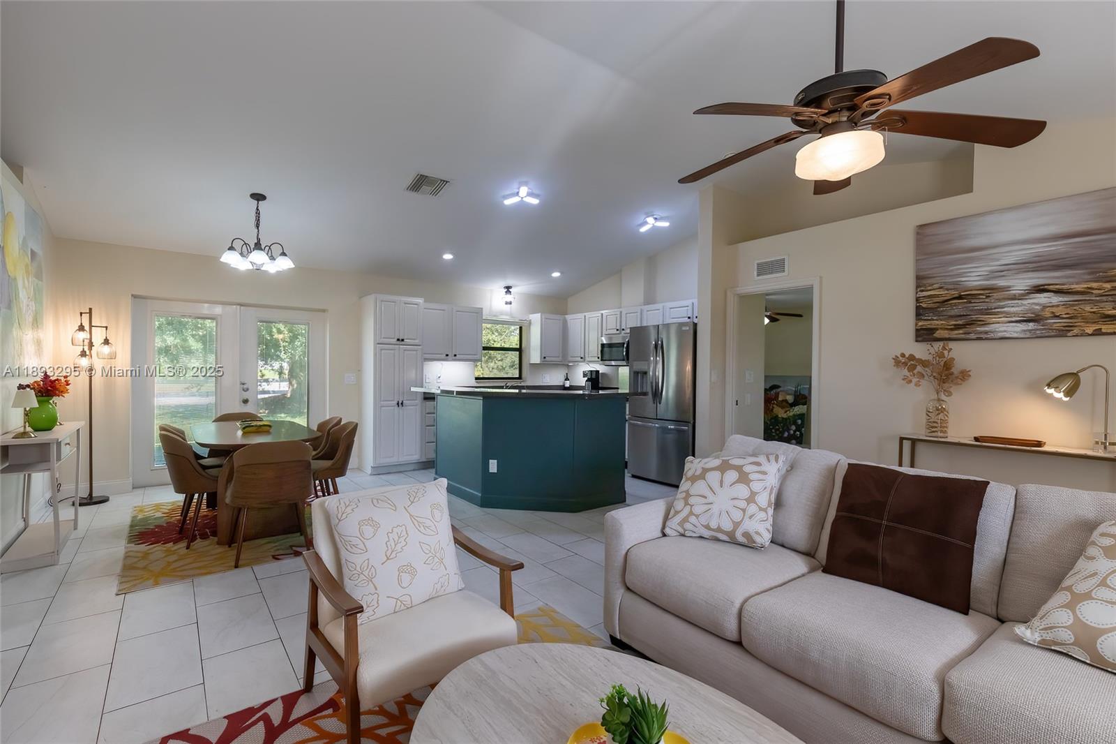 36 Quail Roost Road Lake Placid, FL 33852 - Photo 15 of 48 a living room with furniture and kitchen view