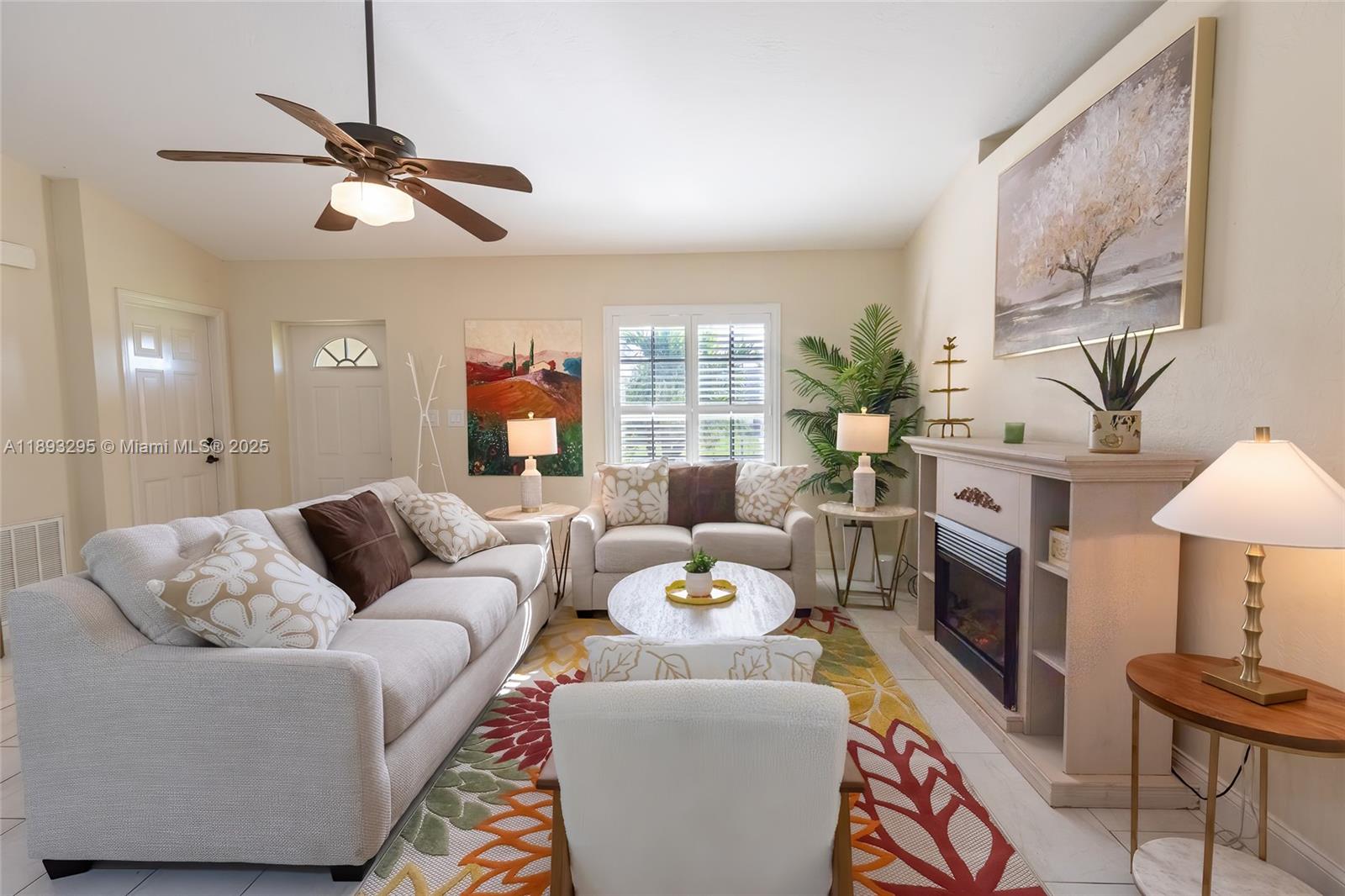 36 Quail Roost Road Lake Placid, FL 33852 - Photo 16 of 48 a living room with furniture and a fireplace