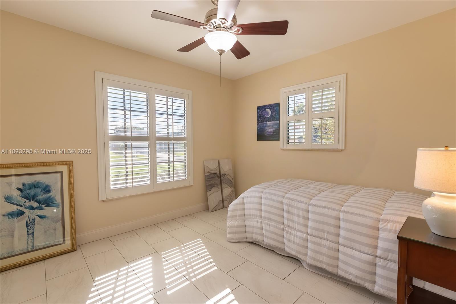 36 Quail Roost Road Lake Placid, FL 33852 - Photo 30 of 48 a bedroom with a bed and a window