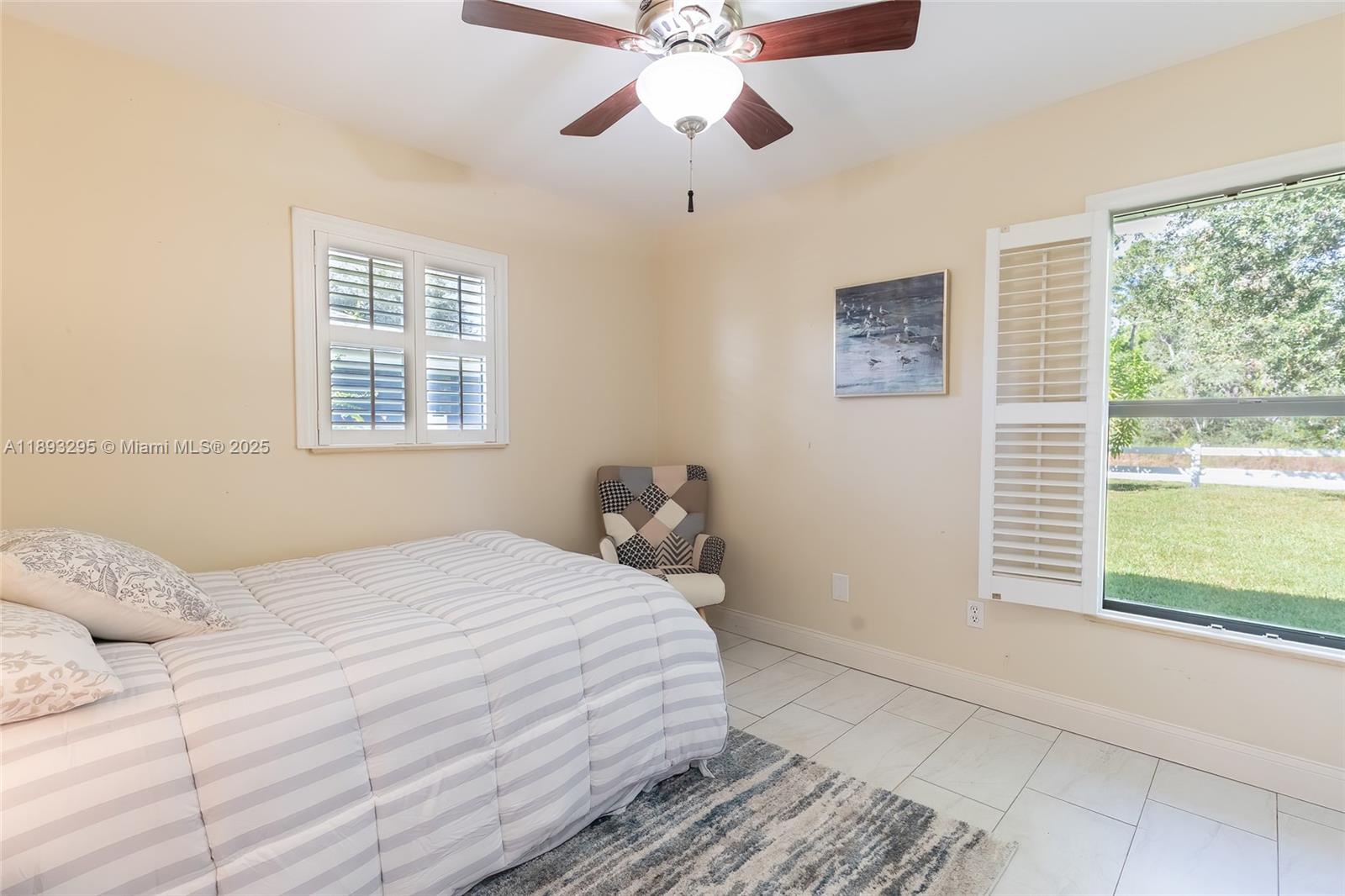 36 Quail Roost Road Lake Placid, FL 33852 - Photo 36 of 48 a bedroom with a bed and a window