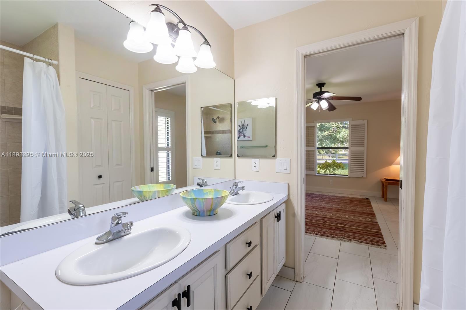 36 Quail Roost Road Lake Placid, FL 33852 - Photo 40 of 48 a bathroom with a sink and a mirror