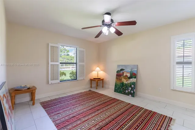 a bedroom with a bed and a chair