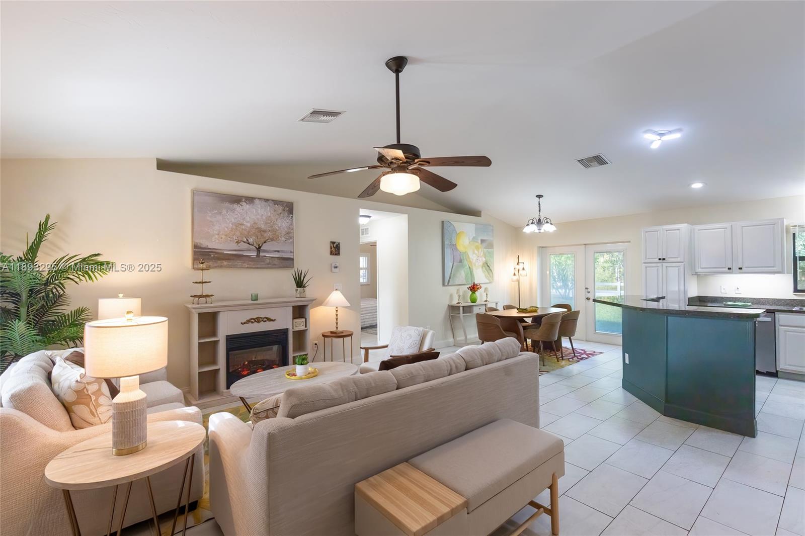 36 Quail Roost Road Lake Placid, FL 33852 - Photo 9 of 48 a living room with furniture and a fireplace