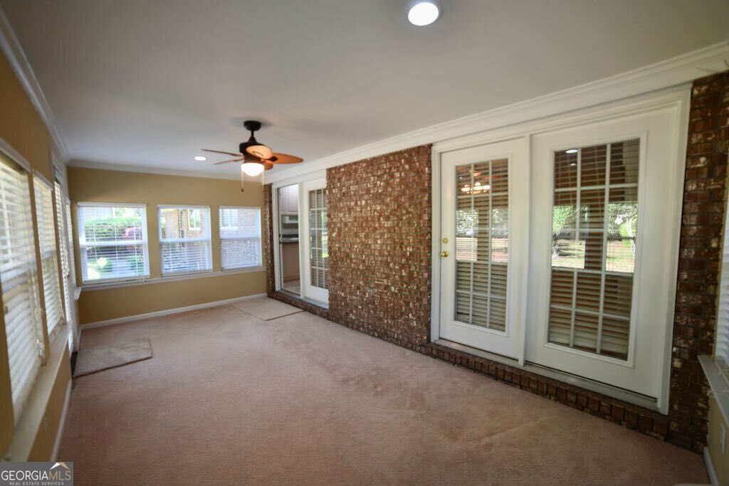 39 Adams Street Jesup, GA 31545 - Photo 24 of 49 a view of empty room with floor to ceiling windows