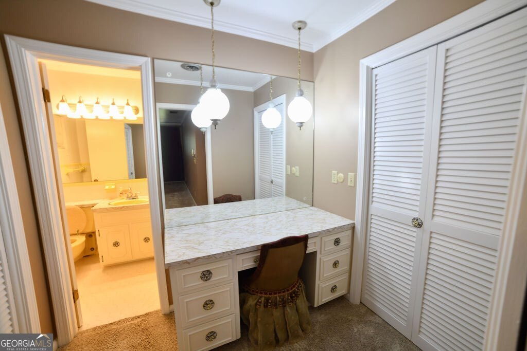 39 Adams Street Jesup, GA 31545 - Photo 32 of 49 a bathroom with a granite countertop sink and a mirror