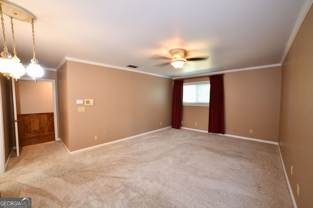 39 Adams Street Jesup, GA 31545 - Photo 37 of 49 a view of an empty room with a window
