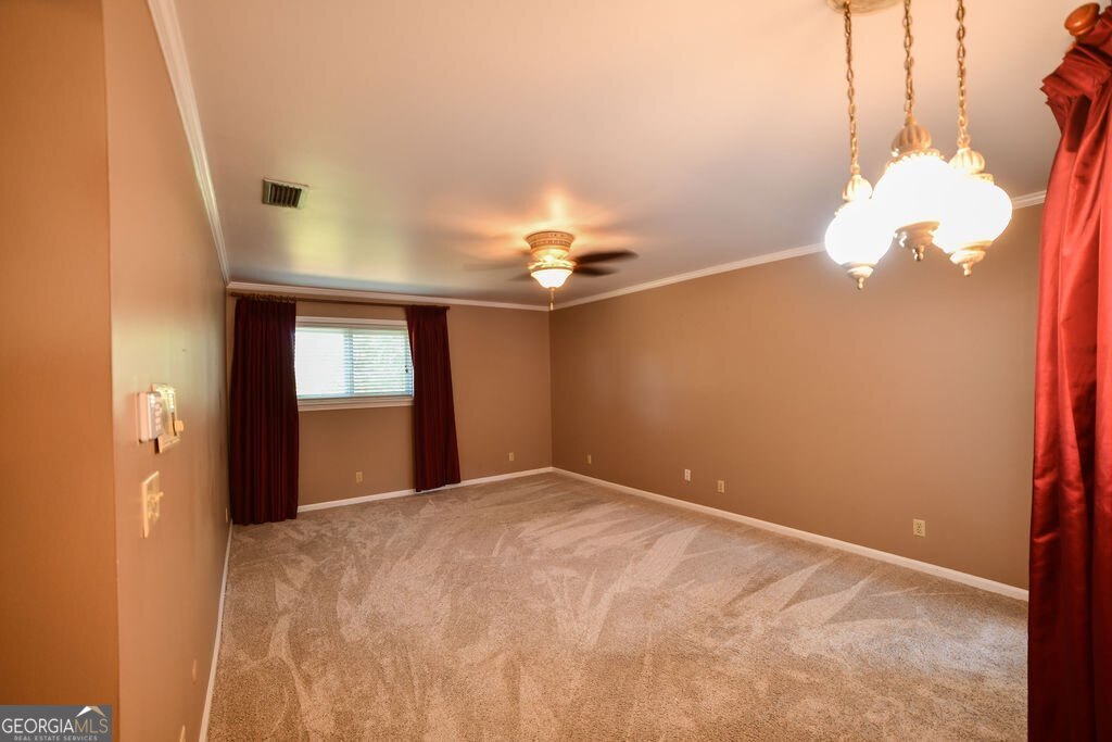 39 Adams Street Jesup, GA 31545 - Photo 40 of 49 a view of a livingroom with a chandelier fan