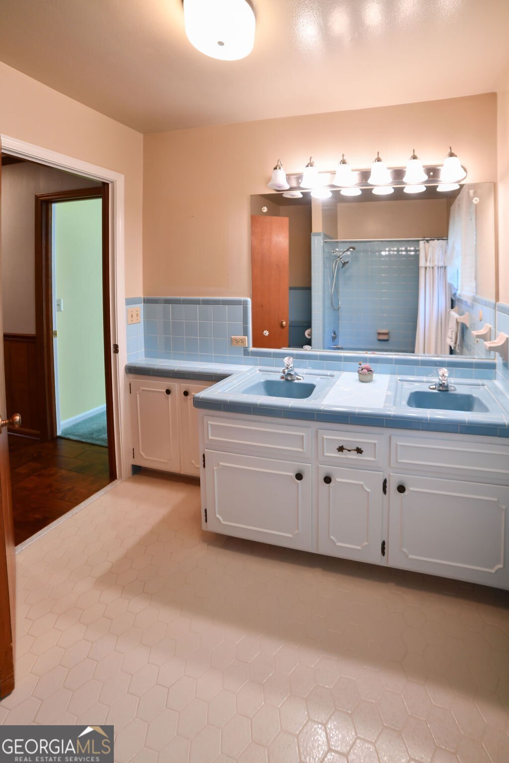 39 Adams Street Jesup, GA 31545 - Photo 47 of 49 a bathroom with a granite countertop sink and a mirror
