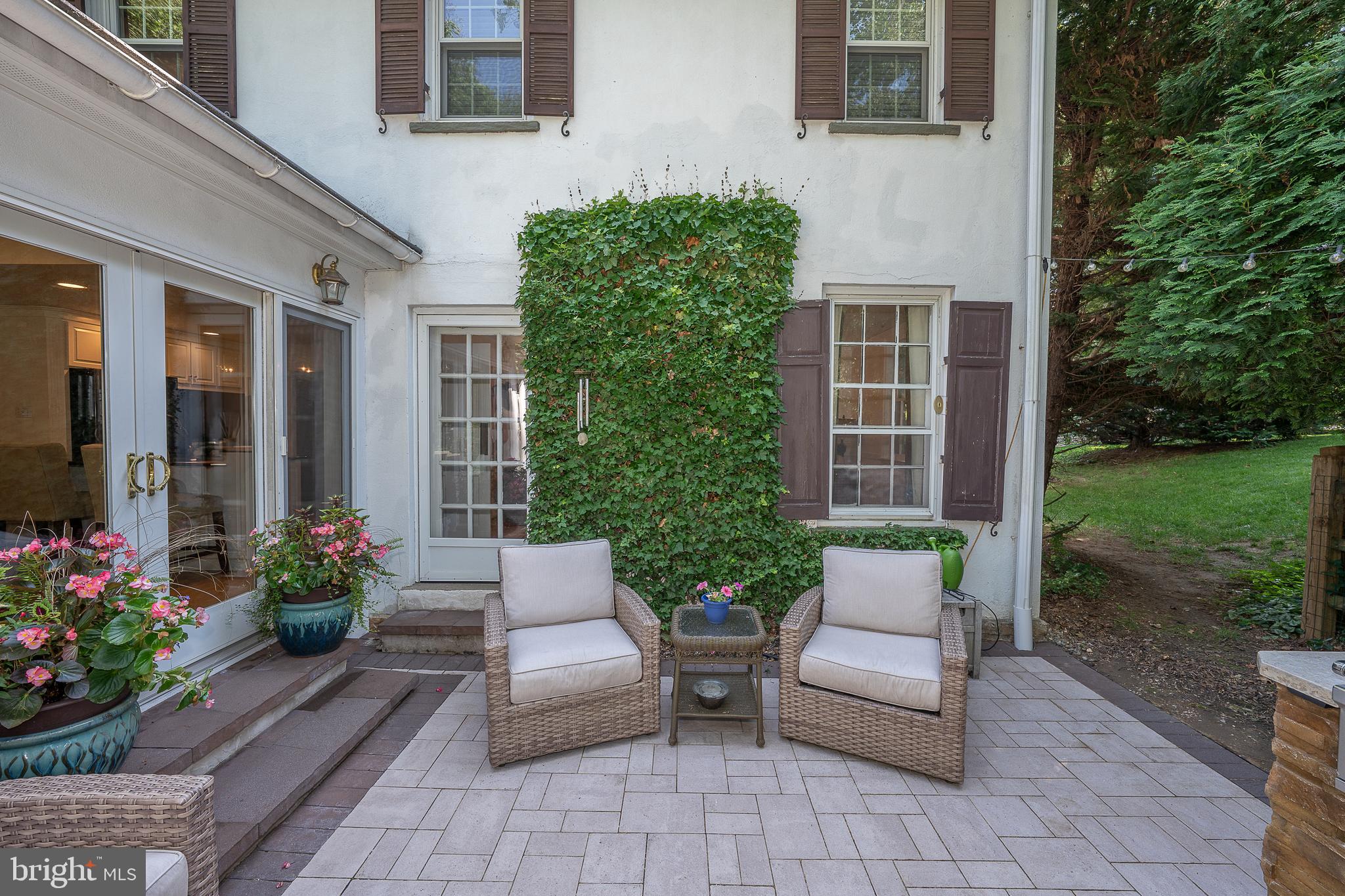 406 Devon State Road Devon, PA 19333 - Photo 6 of 14 a view of a patio with a chairs and table in a patio