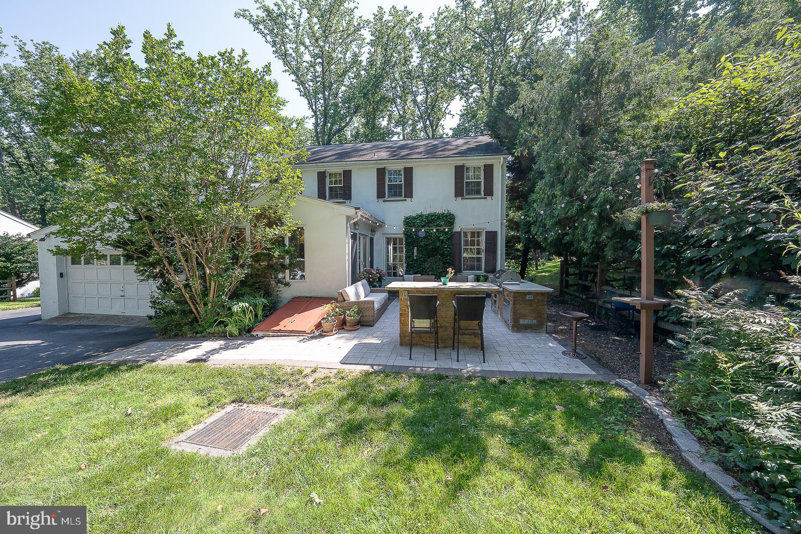 406 Devon State Road Devon, PA 19333 - Photo 8 of 14 a view of a house with backyard and sitting area
