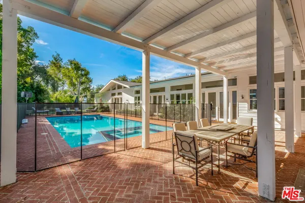 a view of a balcony with wooden floor