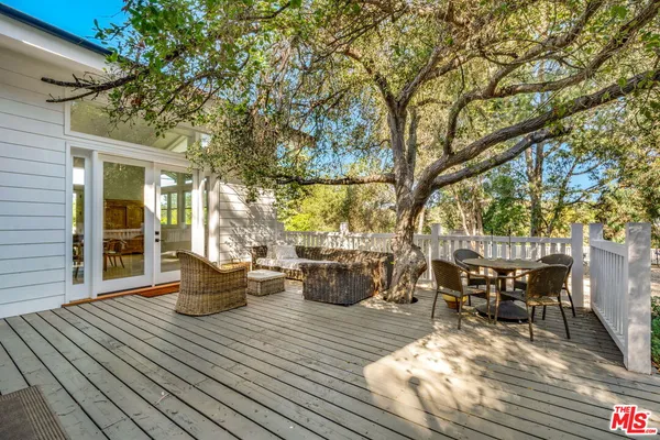 a spacious bedroom with a bed and a couch
