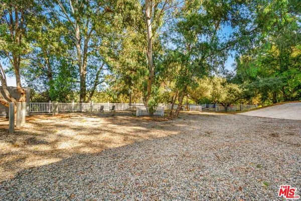 a view of a balcony with wooden floor