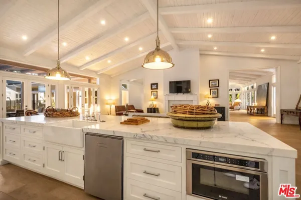 a living room with furniture or couch and a large window