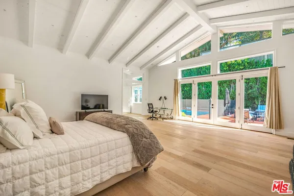 a view of kitchen with stainless steel appliances granite countertop a stove a sink and a refrigerator