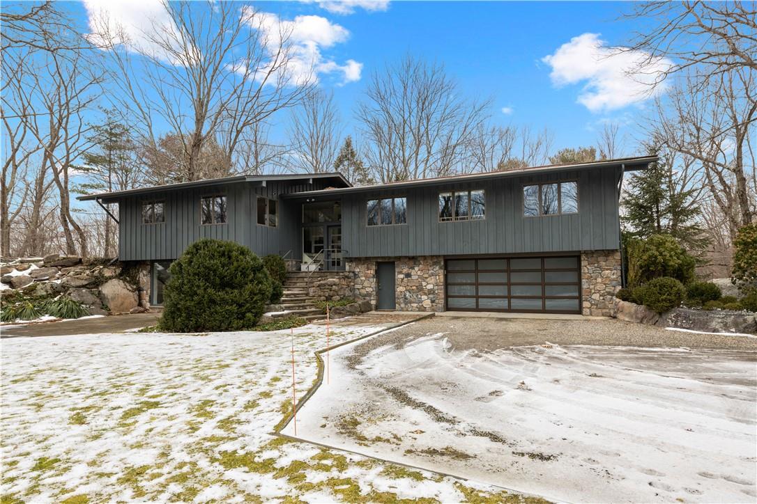 5 Cradle Rock Road East Pound Ridge, NY 10576 - Photo 1 of 1 a front view of a house with a yard