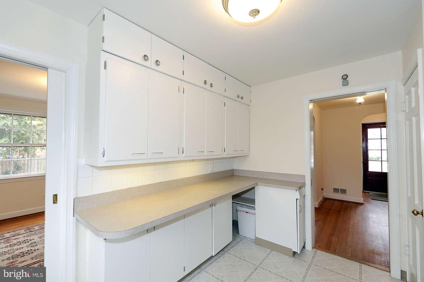5719 Ogden Road Bethesda, MD 20816 - Photo 11 of 22 a room with a walk in closet and wooden floor