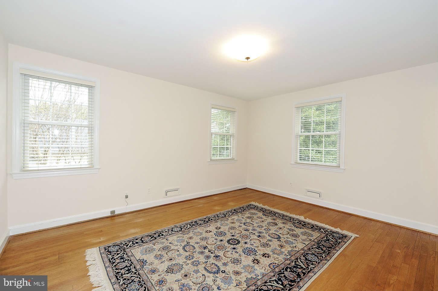 5719 Ogden Road Bethesda, MD 20816 - Photo 12 of 22 a view of an empty room with a window